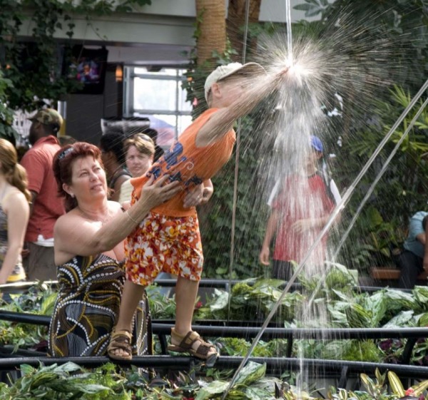 Child enjoying the water fountain in the Navy Pier Winter Garden